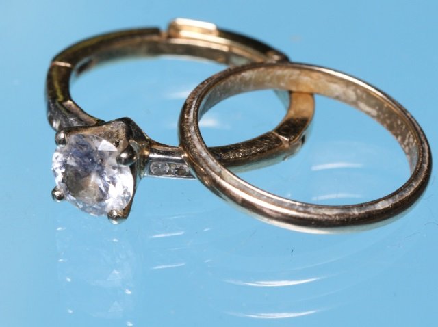 *2 14K YELLOW GOLD RINGS: Solitaire set with 1 round brilliant cut diamond, approximate weight 0.91 carats, J-K color, SI1 clarity, in a 14K yellow gold mount with expandable shank, further channel set with 6 small single cut 