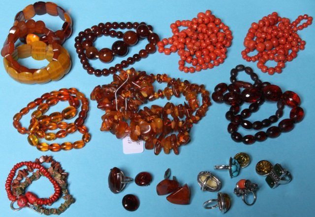 *GROUP OF MISCELLANEOUS JEWELRY: Coral bead necklaces, amber necklaces, bangles, assorted earrings and cuff links.