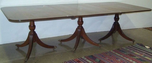 GEORGIAN STYLE DINING TABLE: Having 3 sections and 3 leaves.