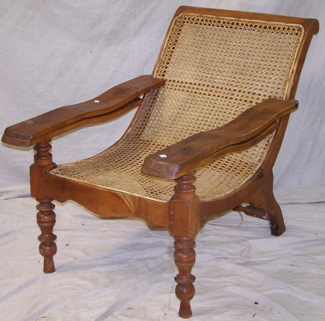 *DECK CHAIR: Having cane back and seat, raised on circular turned legs, approximate height 35", width 28", depth 45".