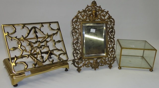 *3 PIECES: Brass framed mirror decorated with mask, approximate height 11", flora and scroll work, folding bookstand and display case.