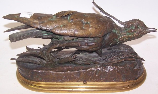 *MOIGNIEZ, JULES: (1835-1894 French) Bronze sculpture depicting quail amidst grass, signed "J. Moigniez", approximate height 7", length 12".