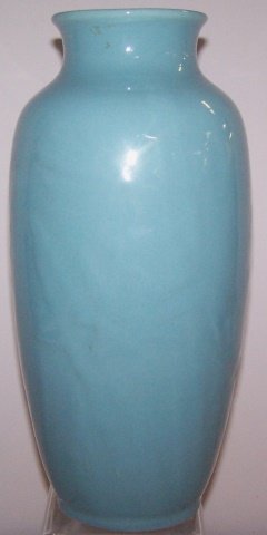 *ROOKWOOD ART POTTERY VASE: Having blue crystalline glaze with daffodil decoration in relief, marks include impressed Rookwood flame logo with Roman numeral XLVI for date 1946, shape #6870, also marked "86", underside has center