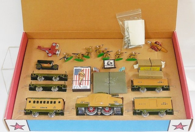 *RICH-ART 30 PIECE O GAUGE WW1 ARMY TRAIN SET: #9203 armored locomotive, #9214 box car, #9212 gondola, 2 #9211 flat cars, #9252 coach, soldier figures, military plane, field gun, map, etc., all in original box.