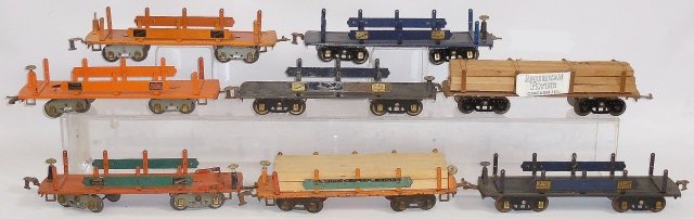 *8 AMERICAN FLYER STANDARD GAUGE MACHINERY CARS: Various years and colors, 2 have lumber loads.