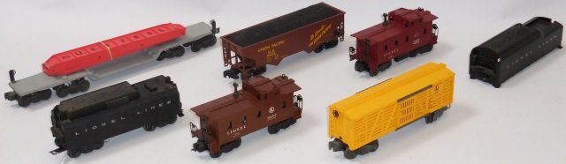 *7 PIECES OF LIONEL O GAUGE ROLLING STOCK: Machinery car, tenders, cabooses, hopper, etc.