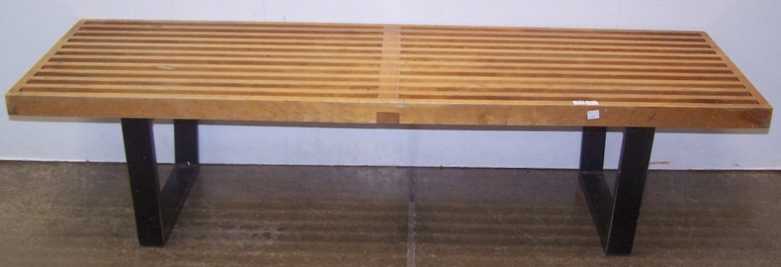 *HERMAN MILLER SLAT BENCH: Having ebony legs, designed by George Nelson, sticker on bottom, approximate height 14", width 56 1/2", depth 18 1/2".