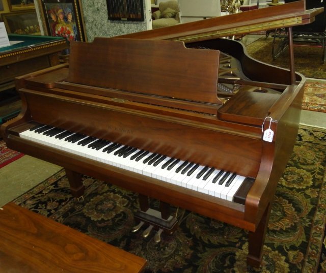K. KAWAI GRAND PIANO: Enclosed in rosewood case.