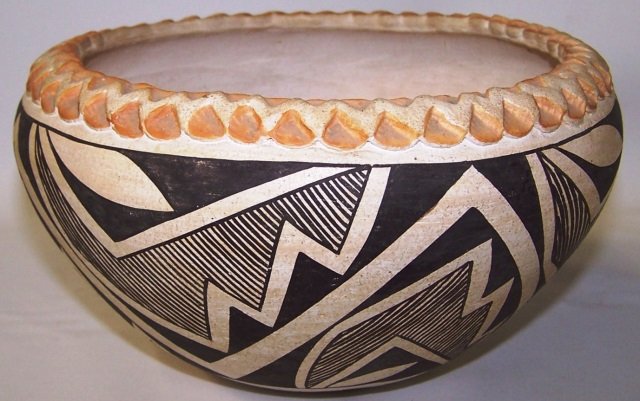 *ACOMA POLYCHROME VESSEL: With piecrust edge, exterior having geometric design, signed "Lucy M. Lewis" (1898-1992), approximate height 4 1/2", diameter 7 3/4".