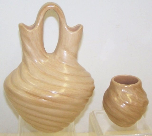 *2 PIECES OF MARY TSOSIE POTTERY: Wedding vase and small jar, both beige with swirl design, both signed "Mary Tsosie Jemez", approximate height 8 1/2" and 3 1/4".