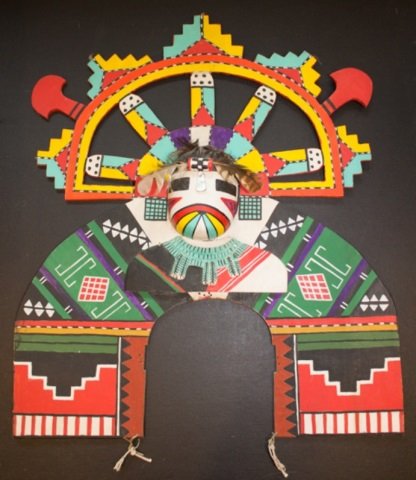 *HOPI TABLITA: Hopi Salako kachina on the front with Aya black cross rattle design on back, having feather and mother-of-pearl on forehead, including strings, approximate height 19 1/2", width 16", depth 2 1/4".