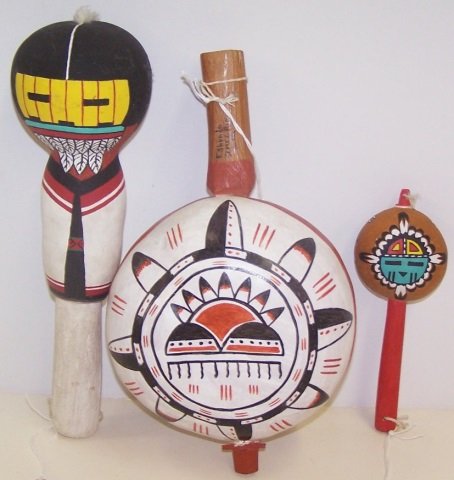 *3 NATIVE AMERICAN RATTLES: Polychrome Pachavuin Mana/Harvest Girl Kachina oblong rattle, white handle, L 11 3/4 x W 4", Traditional Jemez rattle with feathers painted on one side. Feathers, the sun and clouds painted on the oth