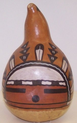 *POLYCHROME PAINTED GOURD: Having kachina face and storm clouds, signed "F. Shendo, Jemez Pue. N. Mex.", approximate height 10", width 6".