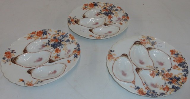 *10 HAVILAND & CO. OYSTER PLATES: Retailed by Warren & Wood, having floral decoration, approximate diameter 7".