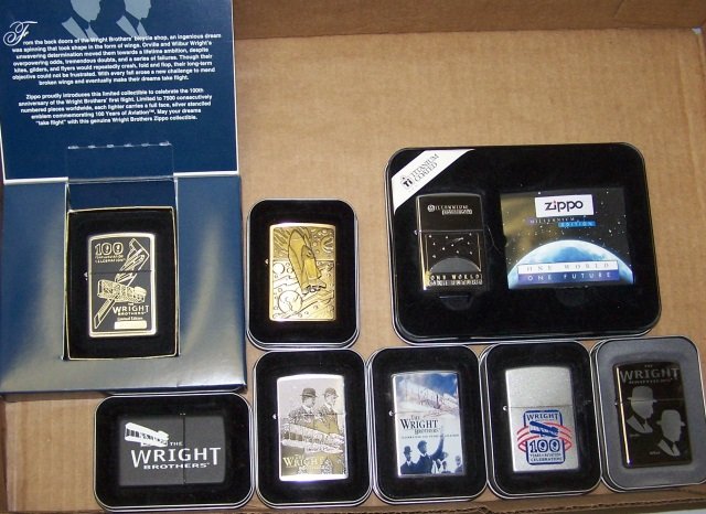 *8 ZIPPO LIGHTERS: Wright Brothers, Millennium edition, rocket, etc., all with seals.