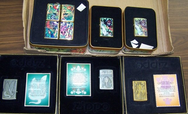 *9 ZIPPO LIGHTERS: 6 Mysteries of the Forest lighters, in fitted cases, 3 Egyptian lighters, cobra with wings, queen with flowers and king, all in fitted box with cards, all have seals.