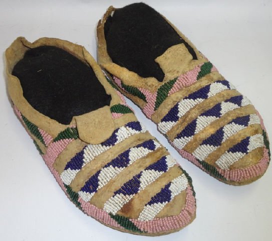 *PAIR OF NATIVE AMERICAN CROW MOCCASINS: Having beaded decoration, beads blue, white, pink and green, approximate size 8 3/4".