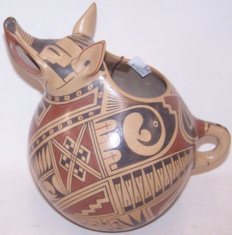 *SOUTHWEST POTTERY FIGURAL PITCHER: Coyote, signed "Felix Ortiz", with geometric design.