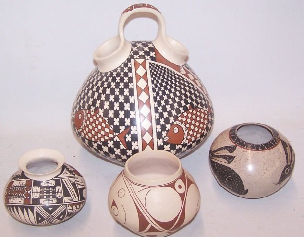 *4 PIECES OF SOUTHWEST POTTERY: Vase decorated with rabbits, signed "Roberto Banuelos", vase having geometric design, signed "Jose L. Loya", vase having geometric design, signed "Carlos, student of Julian Hernandez", and single-hand