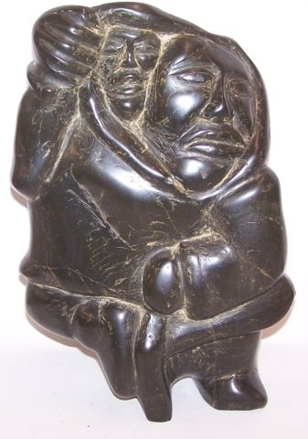 *INUIT CARVED SOAPSTONE SCULPTURE: Mother and child, signed on bottom "Pee", approximate height 13 1/2".