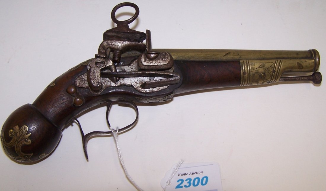 *UNMARKED FLINTLOCK PISTOL: No S/N, .56 caliber, 5 1/2" half octagon/half round brass barrel, smooth wood stock with brass decoration, left side has belt hanger (Antique).