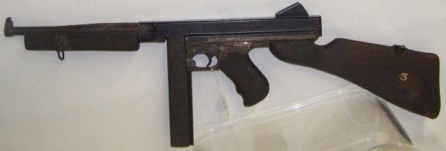 *U.S. THOMPSON SUBMACHINE GUN: Receiver group has been replaced with solid receiver making it a non-gun, with 1 clip.