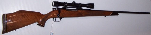 *WEATHERBY MARK 5 BOLT ACTION RIFLE: S/N: P36857, .30-06 Springfield caliber, 24" barrel, blued finish, checkered walnut stock with rosewood forearm tip, Monte Carlo comb with raised cheek piece and 1" recoil pad, left side of barrel mar