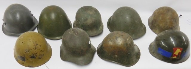 *GROUP OF 9 MILITARY HELMETS: U.S. helmet liner, Romanian, German, etc.