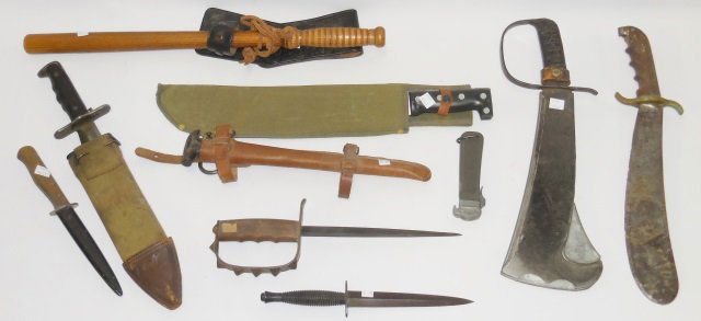 *GROUP: 1 knuckle trench knife, no sheath, 3 U.S. machetes, 1 unmarked fighting knife with black sheath, 1 commando knife, 1 pocket knife, 1 bowie knife with sheath, 1 U.S. military wooden baton with leather