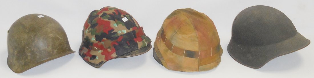 *GROUP OF 4 SWISS MILITARY HELMETS: 2 with camouflage colors.