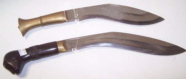 *2 NEPALESE KUKRI KNIVES: 1 with plain steel blade, having carved wood handle and brass mounts, maker's mark on blade, approximate length 18", and 1 with plain blade with brass handle, with maker's mark, length 15 1/2".
