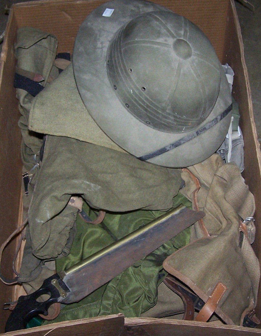 *GROUP OF MILITARY ITEMS: Including helmet, saw and backpacks.