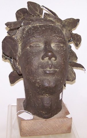 *MERCIER, MARIE ZOE GREENE: (Born 1911 American) Head wearing laurel wreath, bronze sculpture, approximate height 14 1/2".