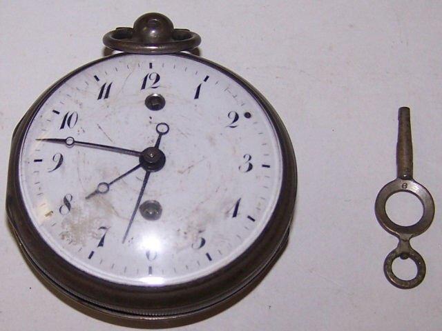 *POCKET WATCH: Key wound and set with Arabic numeral markers on white finish dial, contained in silver open-faced case, with key.