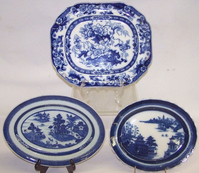 3 FLOW BLUE PLATTERS: 1 with floral decoration, approximate width 12 3/4", 2 decorated with landscapes and architecture, length 10 1/2" and 11 3/4".