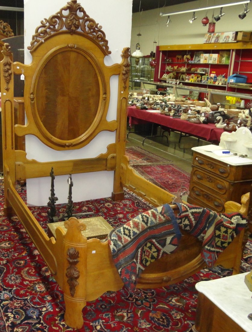 *VICTORIAN BEDSTEAD: Having heavily carved headboard decorated with leafy scroll work and fruit, approximate height 89", width 57", depth 77".