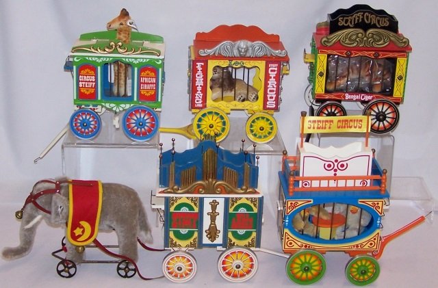 *5-PIECE STEIFF CIRCUS: Elephant, giraffe, tiger, lion and teddy bears, all in carts, with original boxes.