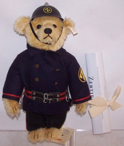 *STEIFF BEAR: Fireman with ax, rope and helmet, growler, approximate height with helmet 13 1/4", with certificate.