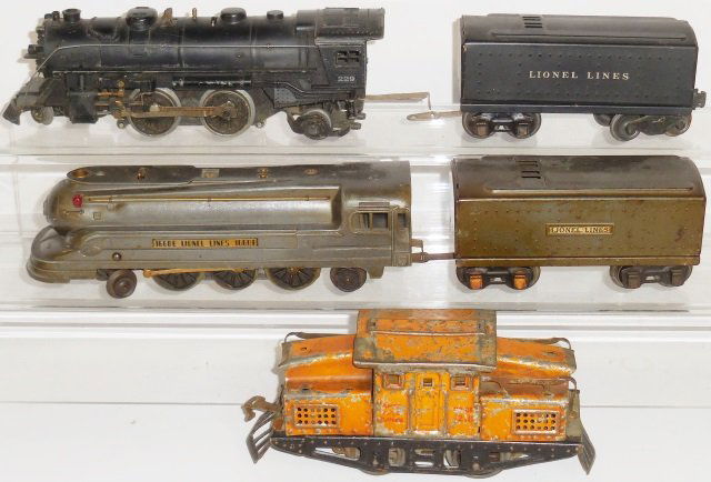*GROUP OF LIONEL O GAUGE LOCOMOTIVES: #1668E steam locomotive and tender, #229 steam locomotive with #02689W tender and #1218 electric locomotive.