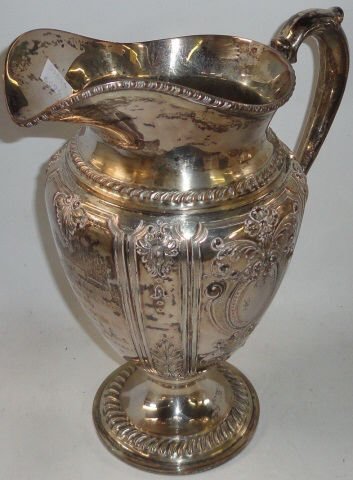 *STERLING SILVER PITCHER: By Frank M. Whiting, "Renaissance" pattern, with hand-chased decoration, marked on underside "1977", engraved "Minton Memorial Trophy, Kentucky State Fair, won by Jean Willcox, 1948, Joan Light Callne