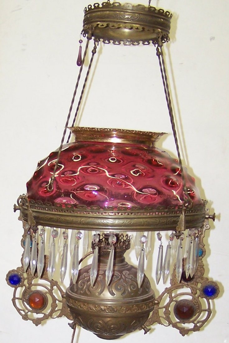 *VICTORIAN HANGING LIGHT FIXTURE: Having ruby glass shade with brass frame, having jeweled decoration.