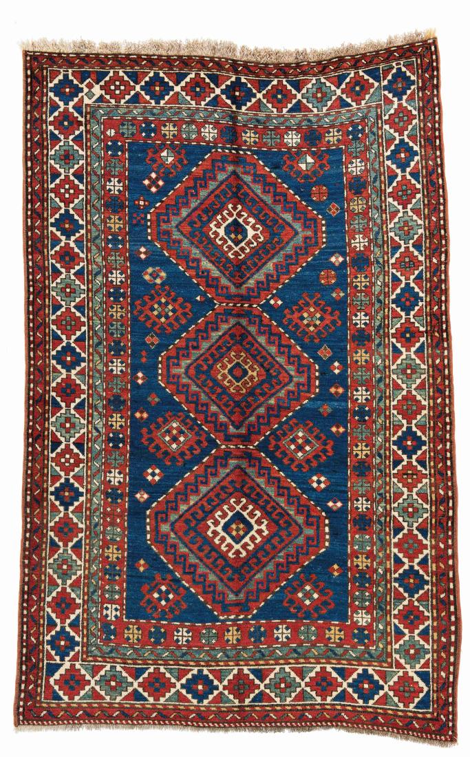 Kazak *: Kazak 214 x 137 cm (7 ft. x 4 ft. 6 in.) Caucasus, ca. 1900 Condition: good, either upper and right bottom corner slightly restored Warp: wool, weft: wool, pile: wool Provenance: Wormser collection, G
