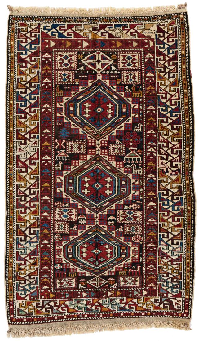 Shirvan *: Shirvan 150 x 97 cm (4 ft. 11 in. x 3 ft. 2 in.) Caucasus, early 20th century Condition: good, slightly corroded brown, one restored crease in the right border Warp: wool, weft: cotton, pile: wool Pro