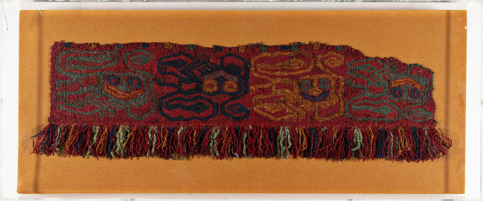 Paracas Decorative Border Fragment: Paracas Decorative Border Fragment 44 x 13 cm (1’ 5” x 5”) Peru, 500 -200 B.C. Condition: fragment, framed and sewn on fabric, slightly stained Camel wool Provenance: Franz & Ing