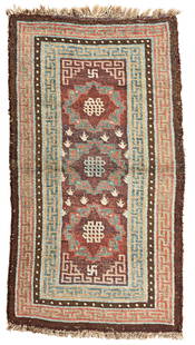 Tibet Rug: Tibet 140 x 78 cm (4' 7" x 2' 7") Tibet, second half 19th century Condition: good, scattered low pile, upper end partially slightly restored, signs of use all around Warp: wool, weft: wool, pile: