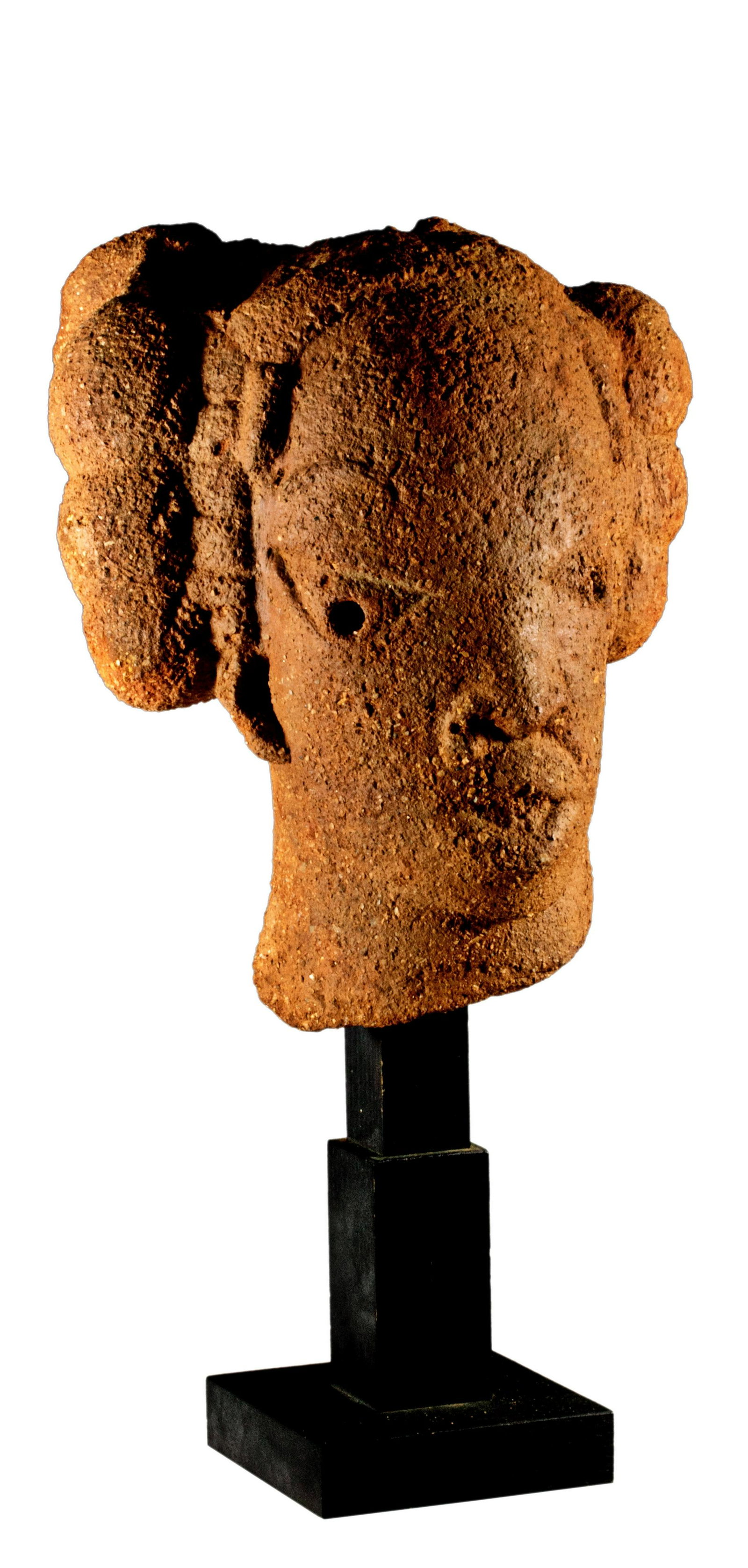 Terracotta Head, Nok: Terracotta Head, Nok H: 28 cm (11") Nigeria, ca. 2000 BC with TL test This head is a part of a full figure adorned with a magnificent knot hairstyle. The typical triangular eyes, beard, and slightly o