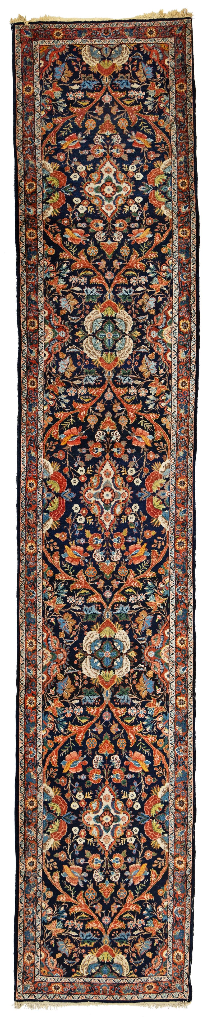 Sarouk Rug: Sarouk 497 x 90 cm (16' 4" x 2' 11") Persia, ca. 1940 Condition: good, good pile, signs of use at sides and ends Warp: cotton, weft: cotton, pile: wool