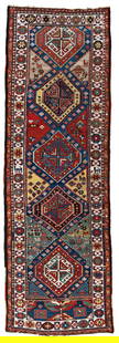 Shulaver Kazak Rug: 318 x 107 cm (10' 5" x 3' 6") Caucasus, late 19th century Condition: good, low pile, several old repairs and reweavings, both ends partially incomplete Warp: wool, weft: wool, pile: wool