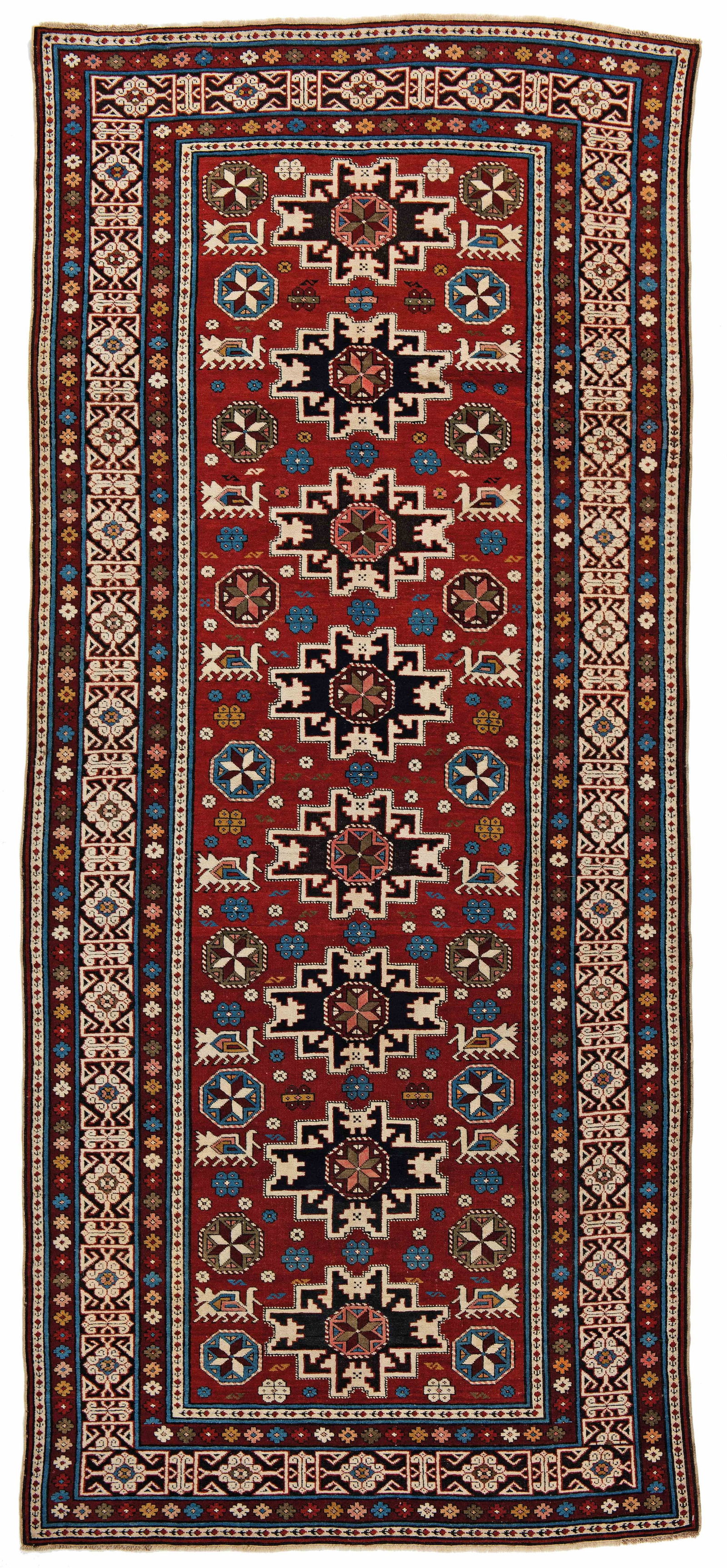 Shirvan Rug: Shirvan 295 x 130 cm (9' 8" x 4' 3") Caucasus, second half 19th century Condition: good, partially corroded brown, scattered low pile, scattered small repairs, selvages rebound Warp: wool, weft: cotto