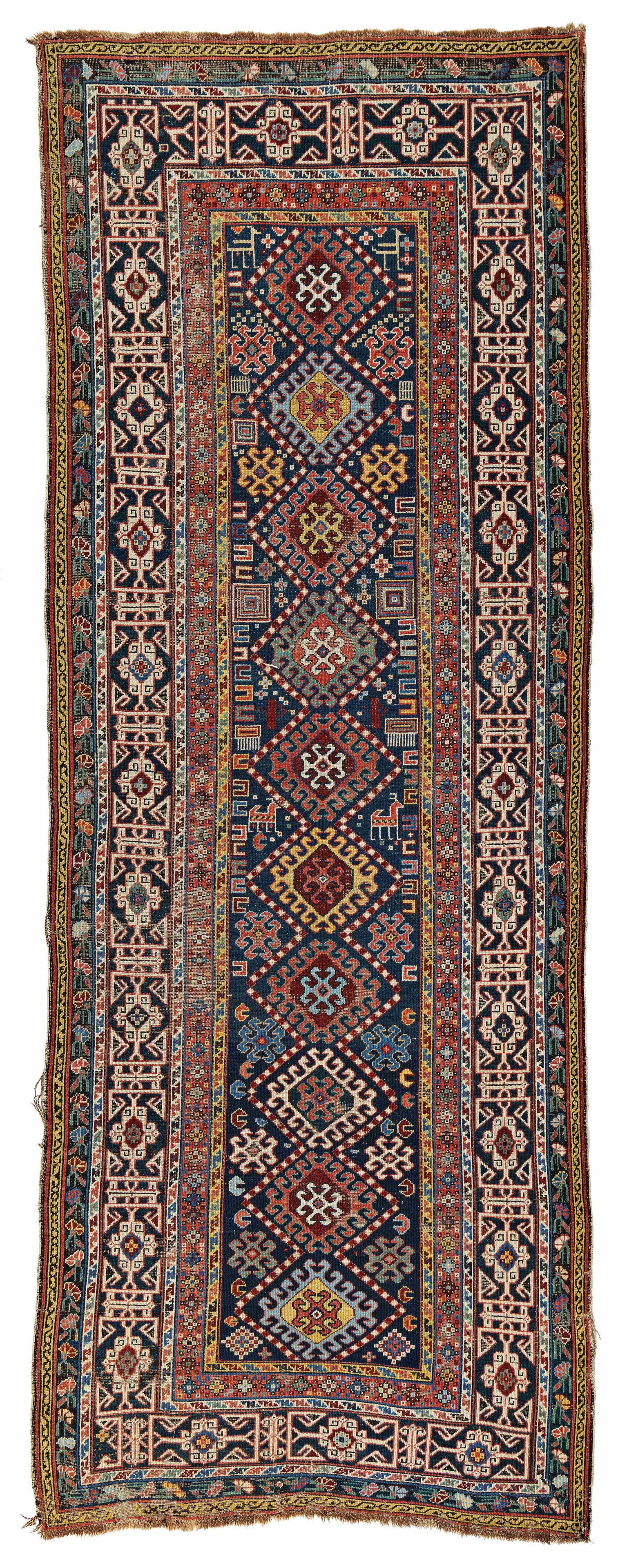 Shirvan Rug: Shirvan 333 x 122 cm (10' 11" x 4') Caucasus, second half 19th century Condition: used, low pile, corroded dark brown, sides and ends partially damaged, several small repairs, signs of use Warp: wool,